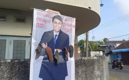 யாழில் அர்ச்சுனாவின் 10 அடி உயர பதாகைக்கு செருப்பு மாலை